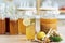Herbal drink. Kombucha tea with lemon and sweetened root filling in glass jug on kitchen background