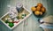 Herbal ingredients of Thai food Spices and knives on a wooden chopping board, garlic, peppers, eggs and lemons on a wooden table