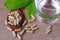 Herbal medicine on wood spool with leaf on wood