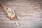 Herbal Medicines / Natural herb capsules on wooden spoon and rustic background selective focus