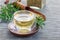 Herbal rosemary tea in a cup on oriental background, horizontal, copy space