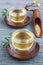 Herbal rosemary tea in a cup on oriental background, vertical
