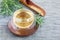 Herbal rosemary tea in a glass cup on oriental background, horizontal