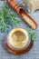 Herbal rosemary tea in glass cup, vertical