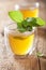 Herbal sage tea with green leaf in glass cup