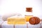 Herbal spa soap bar on white bath towel with honey isolate.