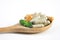 Herbal supplements capsules on wooden spoon on white background for create healthy eating food concept. selective focus