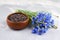 Herbal tea blend with dried cornflower petals and fresh blue flowers bunch