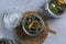 Herbal tea in glass pot on grey