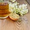 Herbal tea of meadowsweet dried in spoon and mug