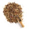 Herbal Tea Pile with a rustic wooden scoop on a white background. Top view