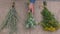 Herbalist placing medical herbs for drying on linen cloth