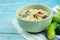 Herbed soya beans with minced pork in coconut milk served in white bowl