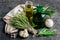 Herbs: rosemary, thyme, bottles of olive oil and garlic