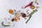 Herbs and spices selection in wooden spoons - rosemary, garlic, salt, pepper on gray table. Food flat lay.