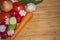 Herbs and vegetables with a blank chopping board. Space for copy.