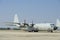 Hercules military transport plane on runway at airport