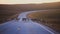 Herd of caribou reindeers pasturing and crossing the road near Nordkapp, Finnmark County, Norway