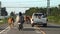 A herd of cows walks on the road in the Thai countryside