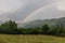 Herd of sheep and rainbow in mountains near Zaqatala, Azerbaij