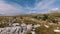 Herd of wild horses galloping fast across the steppe. Aerial FPV Drone Flying over a large group of animals. Sunset