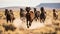 A herd of wild mustangs running across a desert landscape