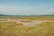 A herd of zebras and a flock of flamingos at Lake Elementaita in Soysambu Conservancy, Naivasha, Rift Valley, Kenya