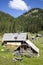 Herdsman wooden hut with solar panels, high in the mountains