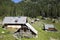 Herdsman wooden hut with solar panels, high in the mountains