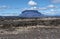 Herdubreid volcano mountain viewed from east and lava formations of Odadahraun desert are at foreground