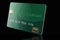 Here is a mock, generic green credit card isolated on the background.