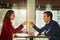 Heres to getting to know each other better. a young man and woman toasting with their drinks on a romantic date at a
