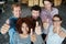 Heres to a job well done. Portrait of a group of smiling coworkers giving the thumbs up at the camera while standing in