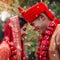 Heres to love and happily ever after. a young hindu couple on their wedding day.