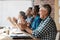 Heres to making business even better. a group of businesspeople clapping hands during a boardroom meeting.