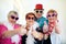 Heres to us the cool kids. a group carefree elderly people wearing sunglasses and showing thumbs up to the camera.