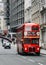 Heritage red Routemaster Bus operating in the City of London. Open platform at back facilitated speedy boarding under