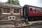 Heritage restored train carriage at railway station platform with Grosmont destination displayed.  North Yorkshire Moors Railway