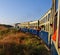 Heritage toy train taking a turn on hilly tracks