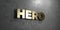 Hero - Gold sign mounted on glossy marble wall - 3D rendered royalty free stock illustration