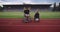 Hero portrait shot of disabled sport people on athletics sports track.