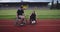 Hero portrait shot of disabled sport people on athletics sports track.