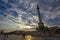 Heroes square Hosok Tere in Budapest, Hungary, at Sunset, with tourists climbing the main statue and column
