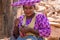 Herrero woman, artisanal doll seller to tourists passing through, Namibia