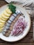 Herring fish with potatoes slices and red onion