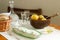 Herring with onions and dill in a glass plate, served with boiled potatoes, bread and vodka. Soviet life. Rustic style, selective