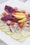 Herring salad with lime, radicchio and cherry tomatoes.