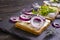 Herring sandwich blue onion on wooden background healthy