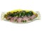 Herring sliced with lemon onion and greens