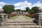 Herstmonceux Castle rose garden entrance, sundial, and John Flamsteed statue